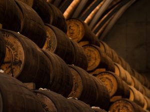 low light photography of pile of barrels