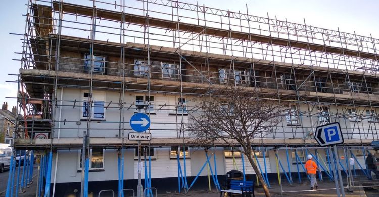 Image shows scaffolding around a building