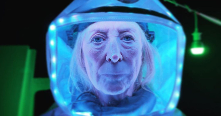 A woman wearing a space helmet