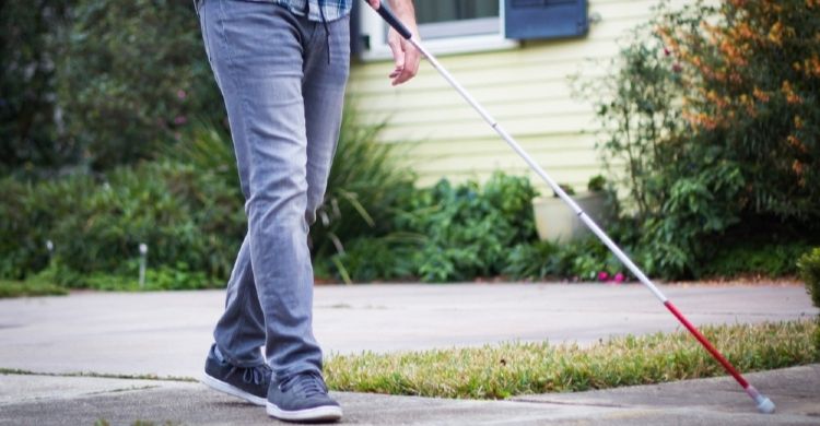 Person walking with a cane
