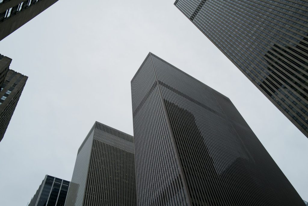 Looking up at tall buildings in a city