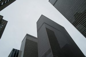 Looking up at tall buildings in a city