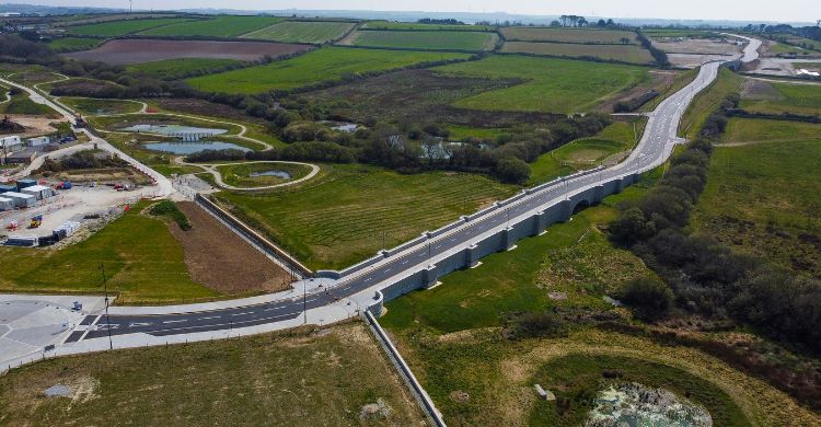 Image shows an aerial view of a new road