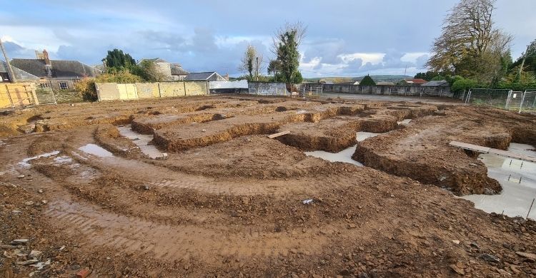 Photograph shows a building site