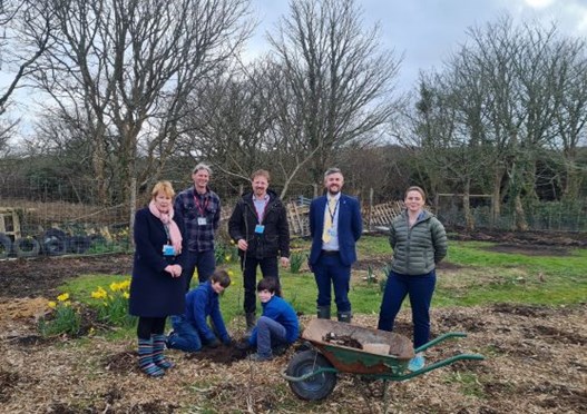 Councillor Linda Taylor at tree planting with pupils and staff at St Ives School